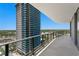 Wide balcony with sleek railing, offering expansive city views from a modern high-rise at 2912 W Santiago St # 1401, Tampa, FL 33629