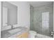 Modern bathroom featuring marble countertop, sleek fixtures, and frameless glass shower at 2912 W Santiago St # 1401, Tampa, FL 33629