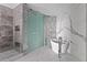 A stunning bathroom with a glass shower and a soaking tub by the marble wall at 2912 W Santiago St # 1401, Tampa, FL 33629