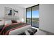 Bright bedroom features balcony access and chic, modern decor at 2912 W Santiago St # 1401, Tampa, FL 33629