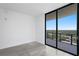 Unfurnished room boasts a private balcony with expansive city views at 2912 W Santiago St # 1401, Tampa, FL 33629