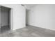 Large, empty bedroom shows neutral paint, grey floors, and an open en-suite bathroom at 2912 W Santiago St # 1401, Tampa, FL 33629