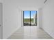 Empty room with natural light pouring in from the large windows overlooking the city at 2912 W Santiago St # 1401, Tampa, FL 33629