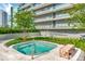 Relaxing hot tub surrounded by lush landscaping and a modern building backdrop, offering a private oasis at 2912 W Santiago St # 1401, Tampa, FL 33629