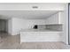 Bright kitchen with white cabinets, marble countertops, and modern appliances at 2912 W Santiago St # 1401, Tampa, FL 33629