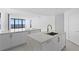 Open kitchen concept with island, white cabinetry, and modern fixtures at 2912 W Santiago St # 1401, Tampa, FL 33629