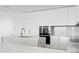 Well-lit kitchen featuring an island with a sink and white cabinets at 2912 W Santiago St # 1401, Tampa, FL 33629