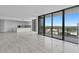 Bright and airy living room featuring floor-to-ceiling windows, modern finishes, and open kitchen at 2912 W Santiago St # 1401, Tampa, FL 33629
