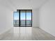 Living room view featuring lots of natural light and a balcony at 2912 W Santiago St # 1401, Tampa, FL 33629