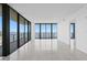 Bright and airy living room featuring floor-to-ceiling windows with beautiful water and city views at 2912 W Santiago St # 1401, Tampa, FL 33629