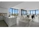 Open-concept living and dining area with floor-to-ceiling windows and water views at 2912 W Santiago St # 1401, Tampa, FL 33629