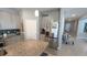 Well-lit kitchen with granite countertops, stainless steel appliances, and ample cabinet space at 32313 Conchshell Sail St, Wesley Chapel, FL 33545