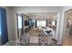 View of the living room and adjoining dining area with cohesive design and ample natural light at 32313 Conchshell Sail St, Wesley Chapel, FL 33545