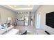 Spacious living area with kitchenette, stainless steel appliances, and ample seating at 32313 Conchshell Sail St, Wesley Chapel, FL 33545