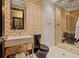 Modern bathroom with walk-in shower, sleek fixtures, and stylish geometric patterned walls at 325 2Nd N St, St Petersburg, FL 33701
