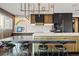 This modern kitchen has black and gold cabinets and seating at the kitchen island at 325 2Nd N St, St Petersburg, FL 33701