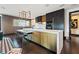 The modern kitchen features sleek cabinetry, a waterfall island with seating, and designer lighting at 325 2Nd N St, St Petersburg, FL 33701