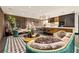 Stylish living room boasts modern furnishings, sleek black floors, and well-lit open floor plan at 325 2Nd N St, St Petersburg, FL 33701