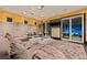 Spacious living room with plush furniture, modern lighting, and large sliding glass doors at 325 2Nd N St, St Petersburg, FL 33701