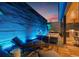 Rooftop patio with fire pit, outdoor kitchen, custom lighting, wood flooring, and comfortable lounge seating at 325 2Nd N St, St Petersburg, FL 33701