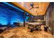 Rooftop outdoor living space with multiple ceiling fans, outdoor kitchen, cozy seating, and a firepit at 325 2Nd N St, St Petersburg, FL 33701