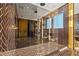 Contemporary bathroom featuring a glass-enclosed shower with black and gold herringbone tile, and modern fixtures at 325 2Nd N St, St Petersburg, FL 33701