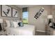 Comfortable bedroom with ample natural light, a serene atmosphere, and stylish decor at 3408 Lumber Falls Dr, Plant City, FL 33565