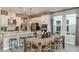 Open-concept kitchen with modern appliances, an island, and an adjacent dining area at 3408 Lumber Falls Dr, Plant City, FL 33565