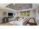 Spacious living room with a large sectional couch, entertainment center, and a game area at 3415 Lumber Falls Dr, Plant City, FL 33565
