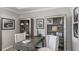 Cozy home office with a wooden desk, two chairs and decorative bookshelves creating a productive workspace at 3415 Lumber Falls Dr, Plant City, FL 33565