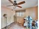 Bedroom featuring wood flooring, a ceiling fan, and neutral paint at 4102 Haines N Rd, St Petersburg, FL 33703