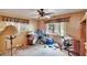 A bedroom with wood flooring, natural light, ceiling fan, and neutral paint at 4102 Haines N Rd, St Petersburg, FL 33703