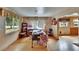 Bedroom featuring wood floors, floral curtains, and windows offering ample natural light at 4102 Haines N Rd, St Petersburg, FL 33703