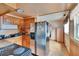 Bright kitchen with stainless steel refrigerator, wooden cabinets and granite countertops at 4102 Haines N Rd, St Petersburg, FL 33703