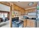 Functional kitchen with wood cabinetry, ample counter space, and easy access to additional living space at 4102 Haines N Rd, St Petersburg, FL 33703