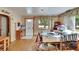 Inviting living room featuring wood floors, a front door, and natural light at 4102 Haines N Rd, St Petersburg, FL 33703
