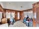 Enclosed sunroom with wood paneling, tile floors, and a variety of adaptive equipment at 4102 Haines N Rd, St Petersburg, FL 33703