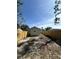View of the spacious backyard enclosed with a new wooden fence, under a clear sky at 4331 Fairfield S Ave, St Petersburg, FL 33711