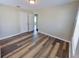 This bedroom is bright and airy with wood flooring and two large windows at 4331 Fairfield S Ave, St Petersburg, FL 33711