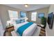 Comfortable bedroom featuring a large bed, bright windows, and stylish decor at 4331 Fairfield S Ave, St Petersburg, FL 33711