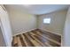 Bright bedroom with a closet and wood-look flooring at 4331 Fairfield S Ave, St Petersburg, FL 33711
