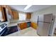 Well-equipped kitchen features stainless steel appliances, granite countertops, and wood cabinets at 4331 Fairfield S Ave, St Petersburg, FL 33711