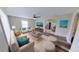 Bright living room with modern furnishings, hardwood floors, and a view into the kitchen at 4331 Fairfield S Ave, St Petersburg, FL 33711