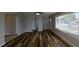 Spacious living room featuring hardwood flooring, neutral walls, and great natural light at 4331 Fairfield S Ave, St Petersburg, FL 33711