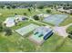 Aerial view of community amenities including pool, Kourt, and racquetball at 4722 Millpond Ln, Tampa, FL 33624