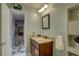 Powder-blue toned bathroom showcases a granite vanity, a framed mirror, and bright vanity lighting at 4722 Millpond Ln, Tampa, FL 33624