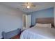 Well-lit bedroom boasts a window, a ceiling fan, and an adjacent door to another room at 4722 Millpond Ln, Tampa, FL 33624