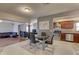Bright dining space with tile floors, modern art, and access to living room and kitchen at 4722 Millpond Ln, Tampa, FL 33624
