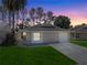 Charming single-story home with a well-maintained lawn and attached garage at 4722 Millpond Ln, Tampa, FL 33624