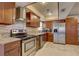 Kitchen with granite counters, stainless appliances, and ample cabinet space at 4722 Millpond Ln, Tampa, FL 33624